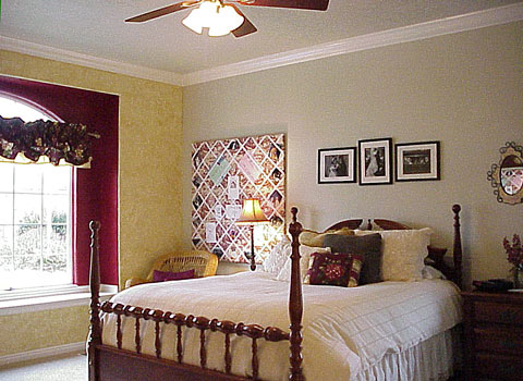 Master suite on the main level features ceiling fan, crown molding, window seat, 2" Cherry wood blinds, handpainted walls...  