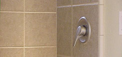 Easy reach shower handle, European shower features full tile surround and a built-in seat