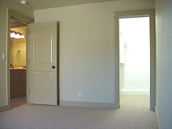 This bedrooms features a walk-in closet, flourescent light, pocket door...