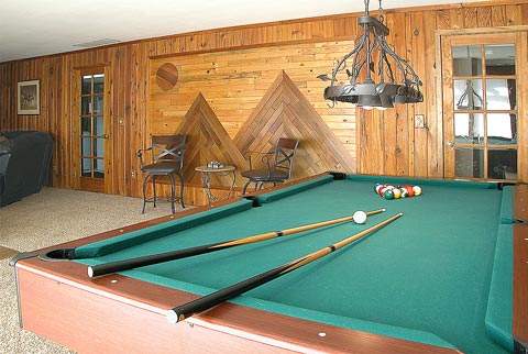 Hanging light over pool table... this room has character...