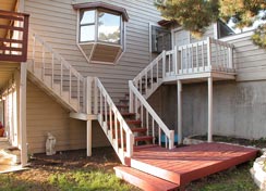 Stairway in backyard to top deck and to back garage door... 