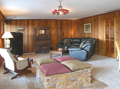 Daylight basement / cozy opposite side from bar features a rock sitting bench for your guest...